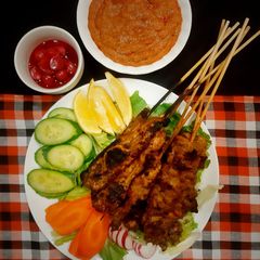 A picture of Chicken Satay with Peanut Sauce.