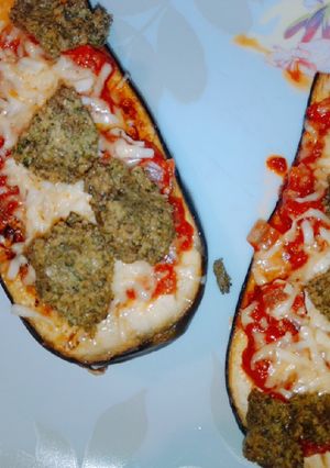Una foto de Berenjenas a la parmesana con pesto.