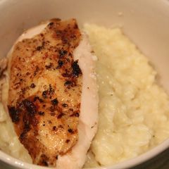 A picture of Roasted Chicken with Garlic Parmesan Risotto.