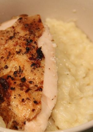 A picture of Roasted Chicken with Garlic Parmesan Risotto.