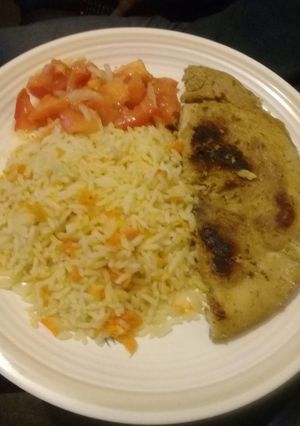 A picture of Pan grilled pork with carrot rice.