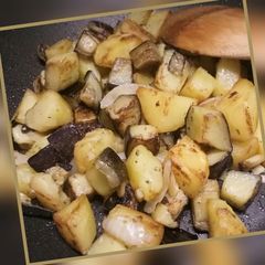 A picture of Sauteed potatoes and aubergine.