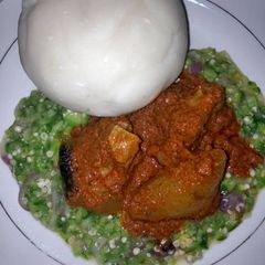 A picture of Okro and tomato stew and fufu.