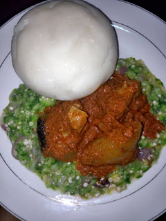 A picture of Okro and tomato stew and fufu.