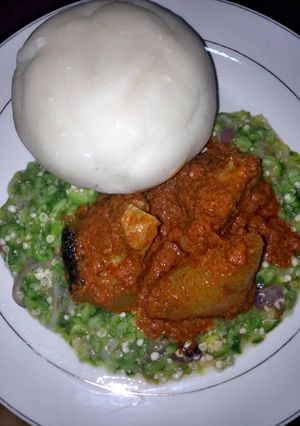 A picture of Okro and tomato stew and fufu.