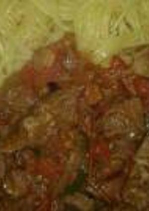 A picture of Stewed beef with spaghetti.