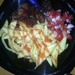 A picture of Tomatoe sauce chips with kachumbari.