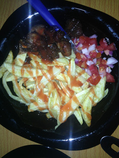 A picture of Tomatoe sauce chips with kachumbari.