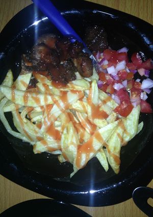 A picture of Tomatoe sauce chips with kachumbari.