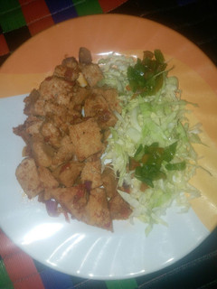 A picture of Fried awara with sauce and cabbage.