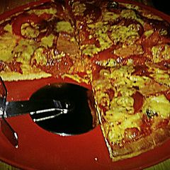 A picture of Tex's Meat Lover's Pizza 🍕🐷🐮🐔🧀.