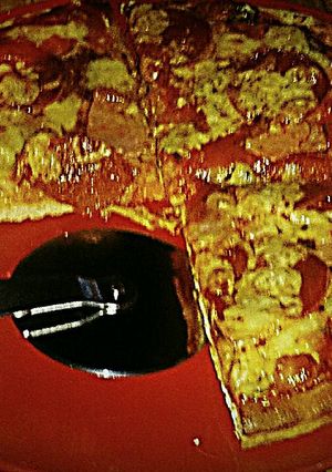 A picture of Tex's Meat Lover's Pizza 🍕🐷🐮🐔🧀.