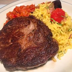 A picture of Steak with Turmeric Rice and Chilli Chutney.