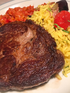 A picture of Steak with Turmeric Rice and Chilli Chutney.