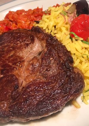 A picture of Steak with Turmeric Rice and Chilli Chutney.