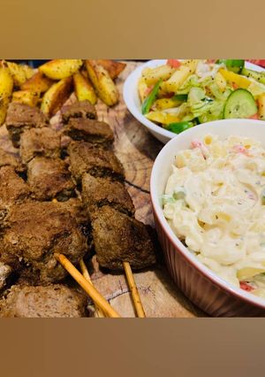A picture of Grilled Beef Skewers with Macaroni and Salad!.