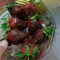 A picture of Cadbury chocolate  dipped strawberries.