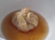 Una foto de dumplings rellenos de carne