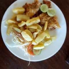 A picture of Roasted potatoes and Tuna fish.