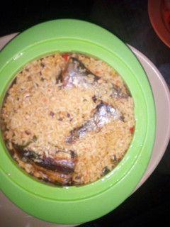 A picture of Jollof rice and beans.