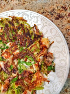 A picture of Pajeon (spring onion pancakes).