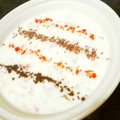 A picture of Onion Cucumber Tomato Raita.