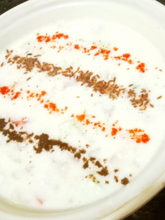 A picture of Onion Cucumber Tomato Raita.