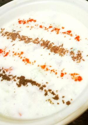 A picture of Onion Cucumber Tomato Raita.