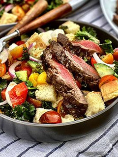 A picture of Grilled Wagyu Steak Panzanella Salad with Vinaigrette.