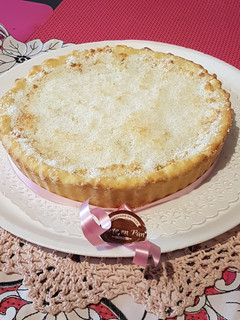 Una foto de Tarta de dulce de leche y coco merengado