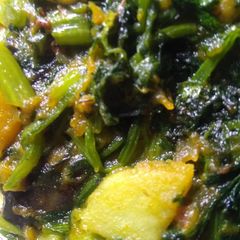 A picture of Spinach and vegetables stir fry.