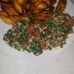 A picture of Veggies omelette with fried plantain.