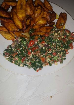 A picture of Veggies omelette with fried plantain.