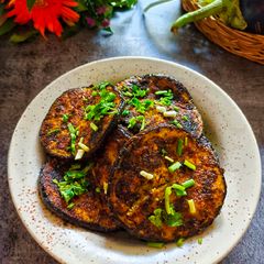 A picture of Begun Bhaja / Paleta / Eggplant fry.