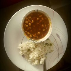 A picture of Soya bean curry with Peas Rice.