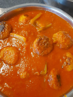 A picture of Meat balls with celery and tomato sauce.