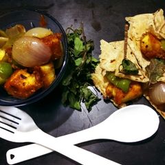 A picture of Paneer chilli with roll.