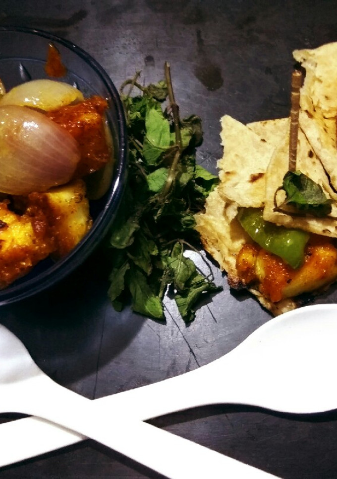 A picture of Paneer chilli with roll.