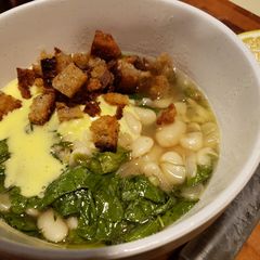 A picture of Rich Butter Beans with Greens, Toasted Bread, and Aioli.