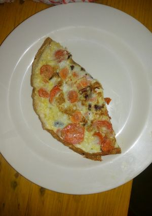 A picture of Fried eggs carrots.