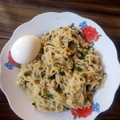 Indomie vegetable with boil egg A picture of Indomie vegetable with boil egg.