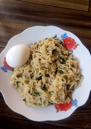 A picture of Indomie vegetable with boil egg.