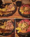 Entrada de Sashimi con plato de fondo Salmón, Paella y Puerros