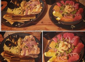 Una foto de Entrada de Sashimi con plato de fondo Salmón, Paella y Puerros
