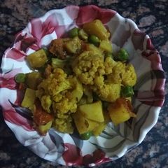 A picture of Cauliflower peas potato veg.
