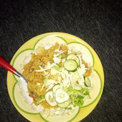 A picture of Jollof rice with bean.