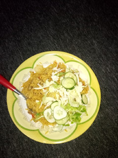 A picture of Jollof rice with bean.