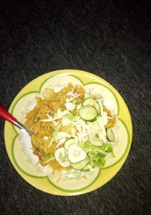 A picture of Jollof rice with bean.
