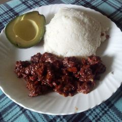 A picture of Pork and ugali.
