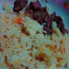 A picture of Carrot Rice with beef.
